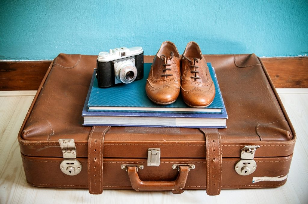 vintage still life with suitcase and shoes